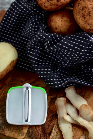 This compact peeler fits neatly in your hand and attaches to your fingers to make a comfortable and easy peeling action. Place either 1 or 2 fingers or even your thumb depending on your dexterity and comfort.  Makes peeling fruits and vegetables simple and efficient. More ergonomic for those with weak grip or limited finger function.
