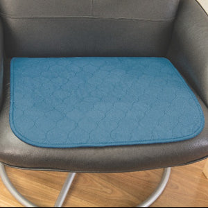 conni absorbent waterproof chair protector. wheelchair protector, furniture protector, chair pad, car seat protector, perfect for travelling. Slimline, comfortable and quiet material. reuse countless times. easy to wash, holds 800ml fluid. Teal colour. great for urine incontinence or excessive perspiration.