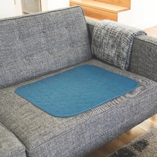 conni absorbent waterproof chair protector. wheelchair protector, furniture protector, chair pad, car seat protector, perfect for travelling. Slimline, comfortable and quiet material. reuse countless times. easy to wash, holds 800ml fluid. Teal colour. great for urine incontinence or excessive perspiration.